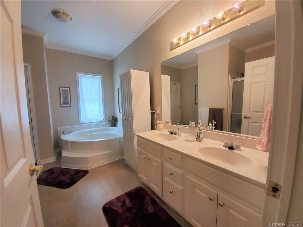 340 Weaver Road Salisbury, NC 28147 - Photo 10 of 23 a bathroom with a double vanity sink and mirror