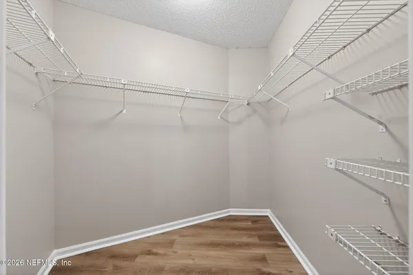 a view of a room with racks on the wall