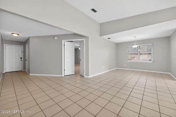 a view of an empty room and window