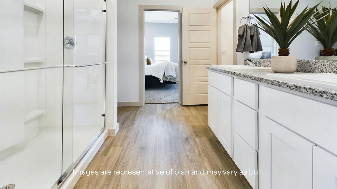 7450 9th Street Lubbock, TX 79416 - Photo 13 of 23 a bathroom with a sink and mirror