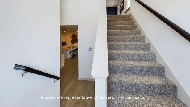 a bed room with a bed and a painting on the wall