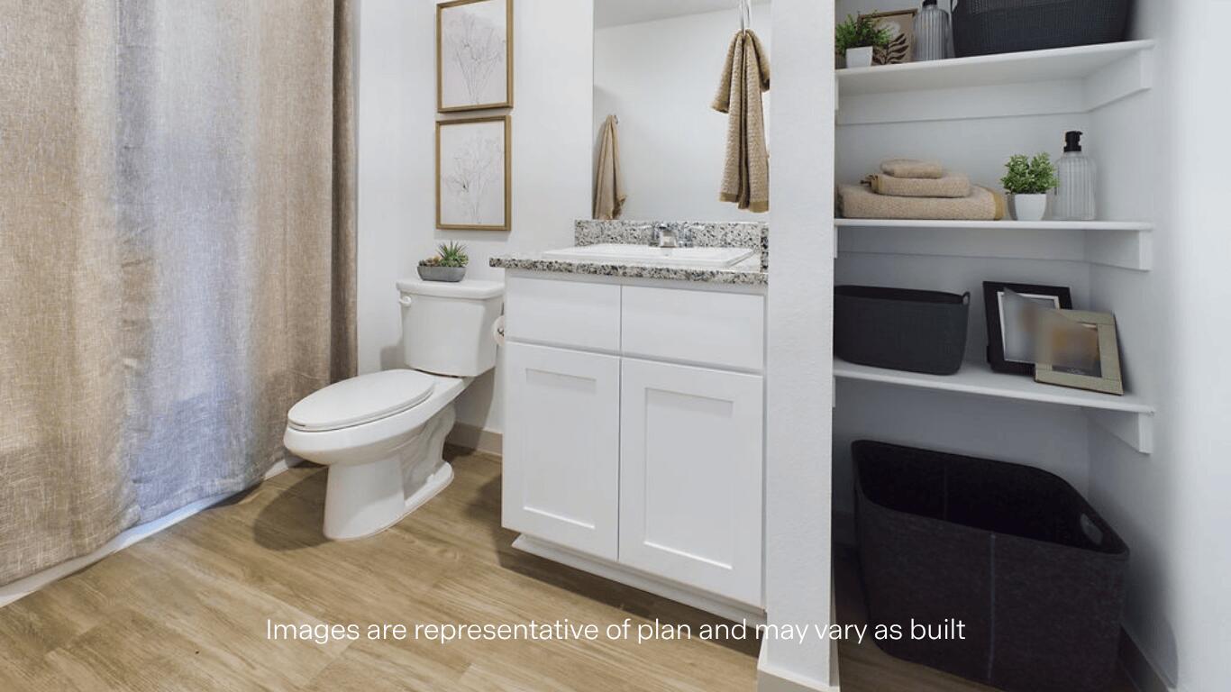 7450 9th Street Lubbock, TX 79416 - Photo 22 of 23 a bathroom with a sink and a toilet