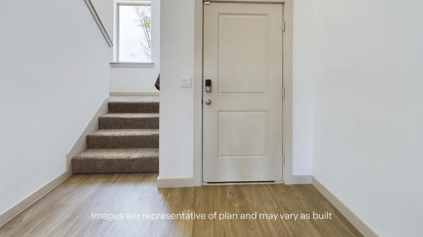 7450 9th Street Lubbock, TX 79416 - Photo 4 of 23 an empty room with wooden floor and windows