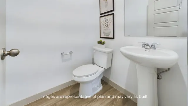 a bathroom with a sink toilet and mirror