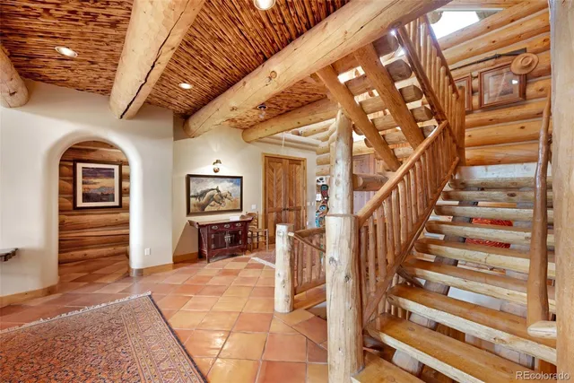 a patio with a table and chairs