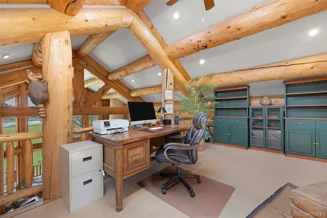 a living room with furniture a flat screen tv and outdoor seating