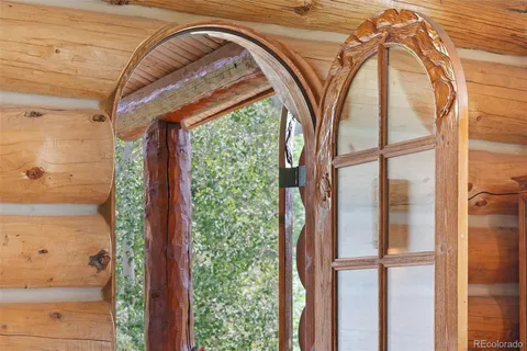 a view of a livingroom with furniture and entryway