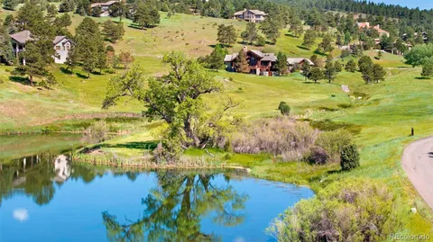 a kitchen with a sink a counter top space and stainless steel appliances
