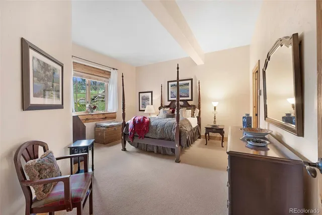 an aerial view of a house with a yard and lake view