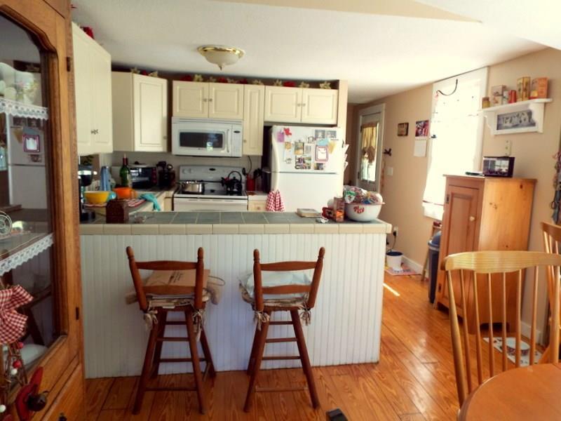15 Neck Road Clinton, CT 06413 - Photo 1 of 1 a dining room with furniture and wooden floor