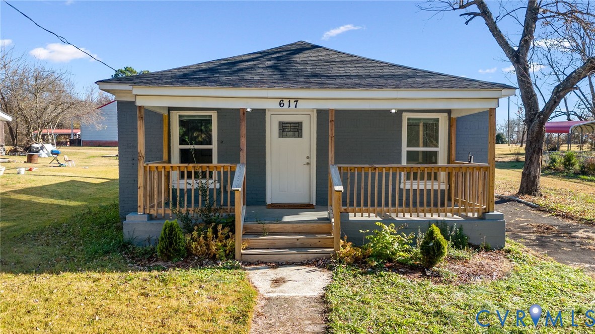 front view of a house with a yard