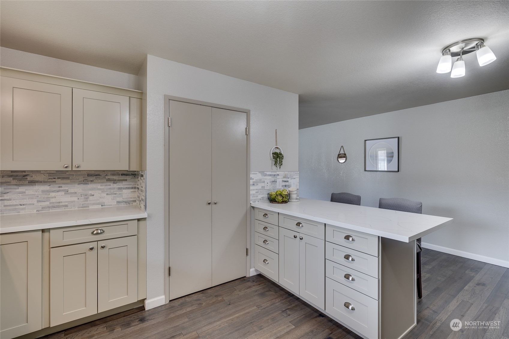 801 Main Street Sultan, WA 98294 - Photo 11 of 40 a kitchen with white cabinets and sink