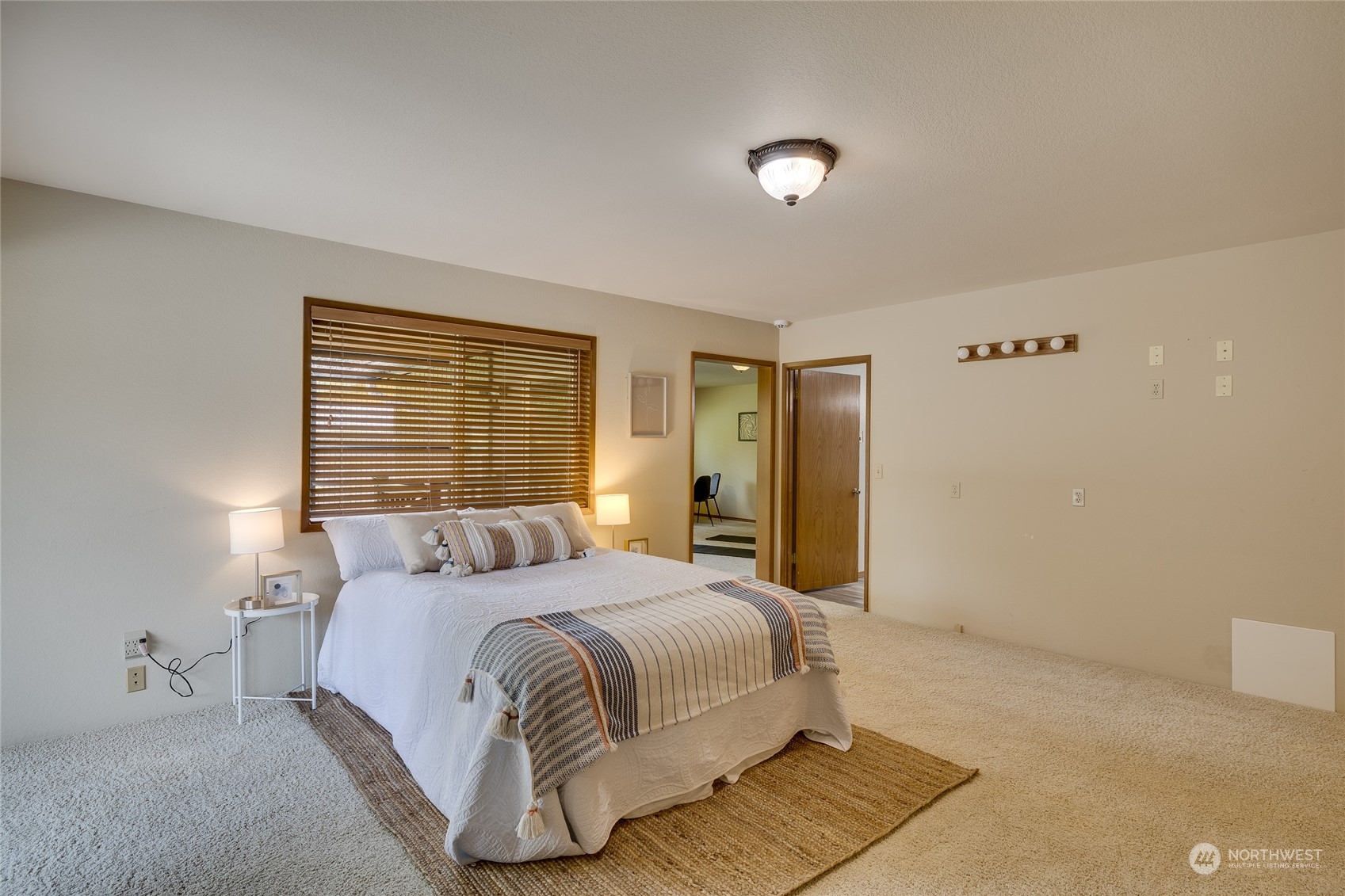 801 Main Street Sultan, WA 98294 - Photo 13 of 40 a bedroom with a bed and a night stand