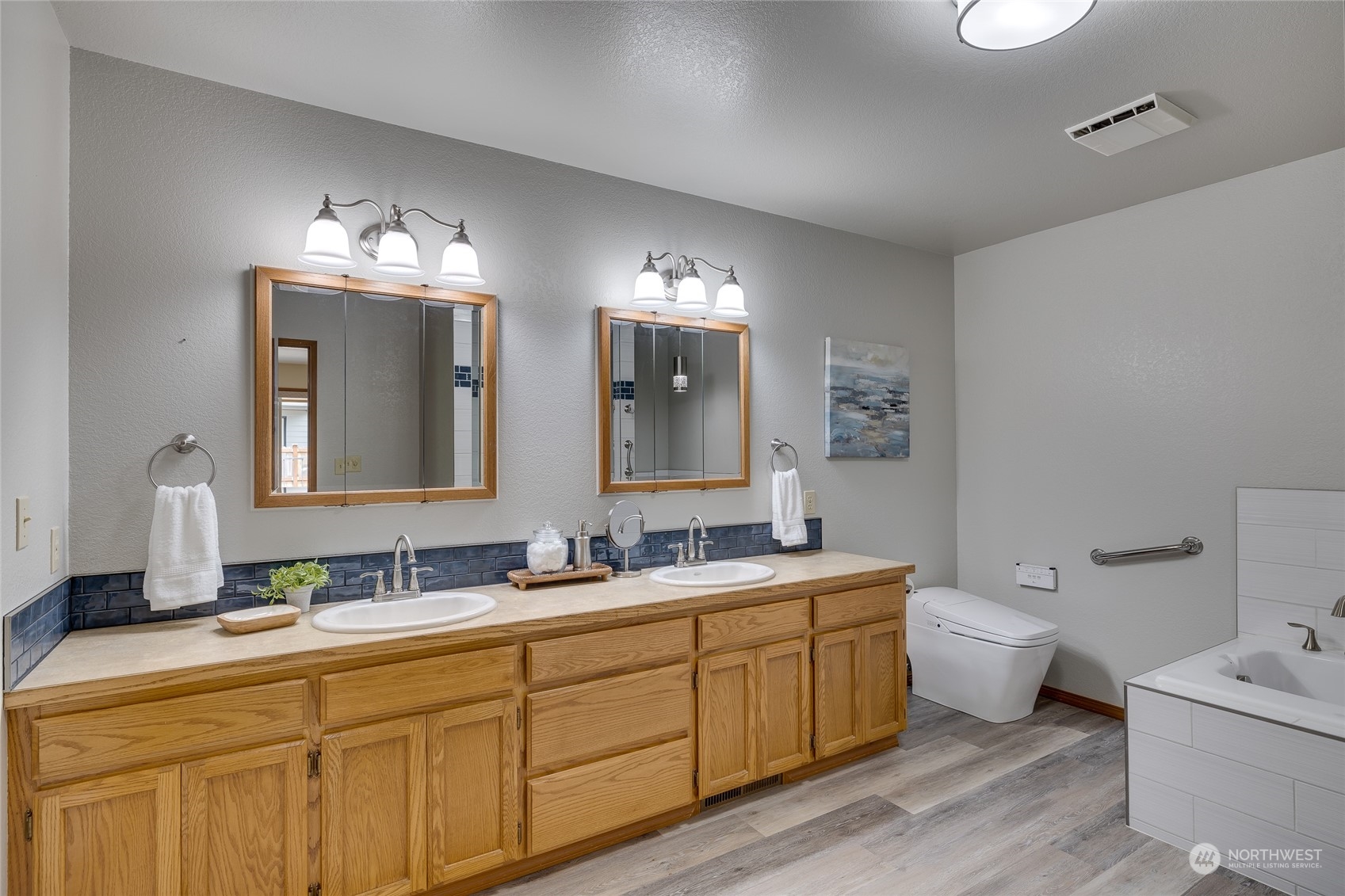 801 Main Street Sultan, WA 98294 - Photo 15 of 40 a bathroom with a double vanity sink and mirror with toilet