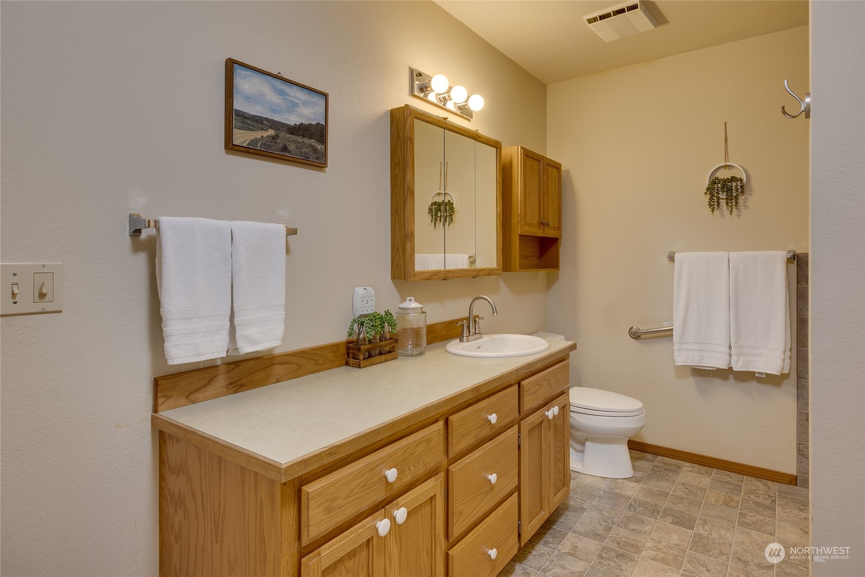 801 Main Street Sultan, WA 98294 - Photo 19 of 40 a bathroom with a sink and a mirror