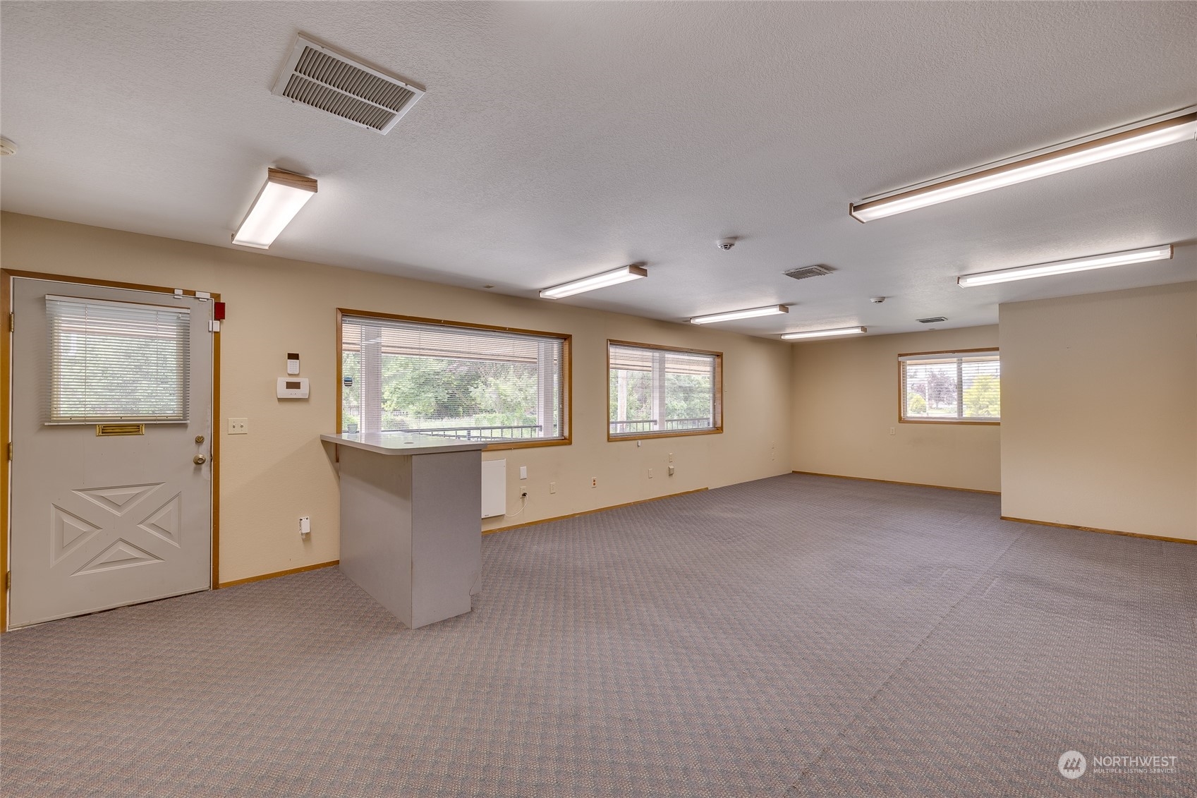 801 Main Street Sultan, WA 98294 - Photo 24 of 40 an empty room with windows and cabinet