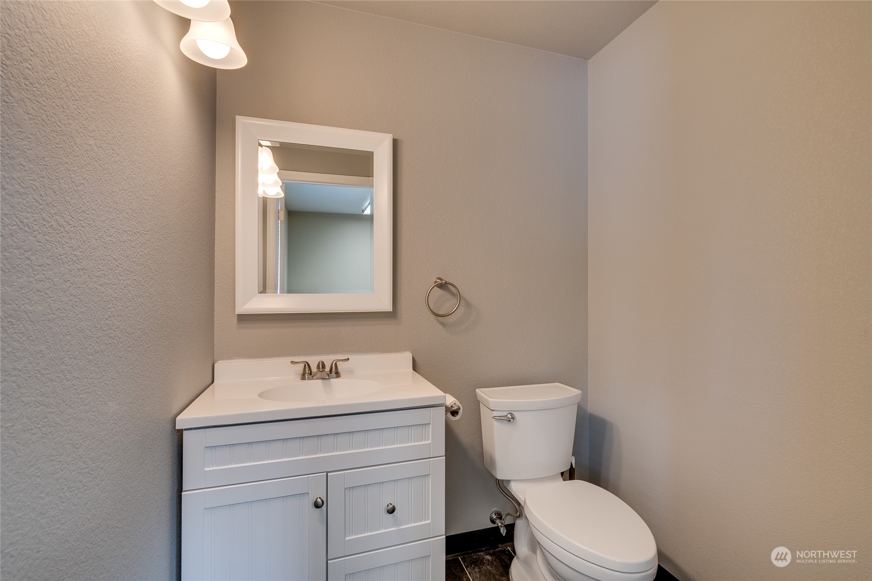 801 Main Street Sultan, WA 98294 - Photo 25 of 40 a bathroom with a toilet sink and mirror