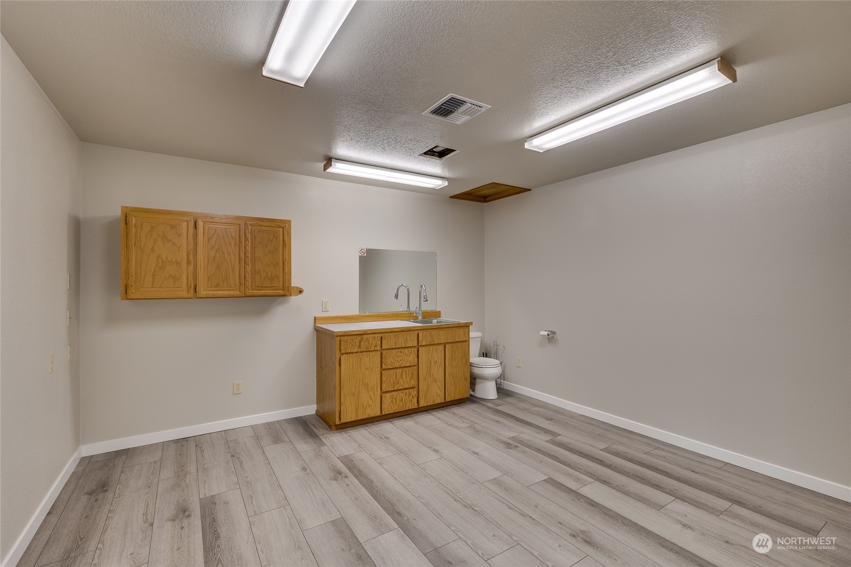 801 Main Street Sultan, WA 98294 - Photo 28 of 40 a room with a wooden floor and window