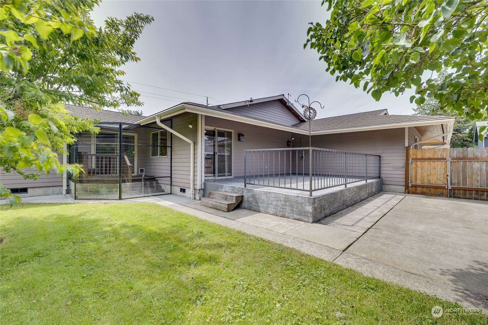 801 Main Street Sultan, WA 98294 - Photo 32 of 40 a view of a house with a backyard and a tree