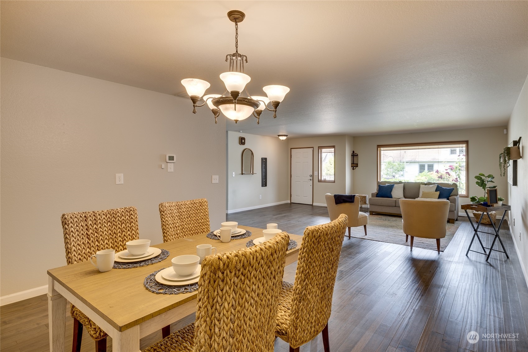 801 Main Street Sultan, WA 98294 - Photo 8 of 40 a view of a dining room with furniture a chandelier and wooden floor