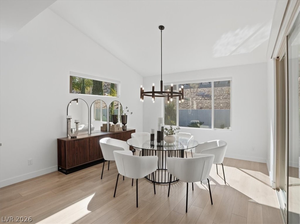 9725 Starlight Ridge Avenue Las Vegas, NV 89148 - Photo 19 of 47 This bright dining room features natural light and offers an inviting atmosphere for meals and gatherings.