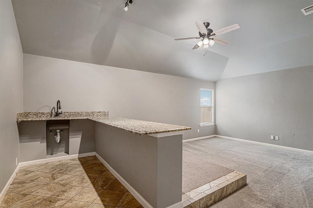 10005 Shelburne Road Fort Worth, TX 76244 - Photo 19 of 26 a view of a livingroom with a kitchen