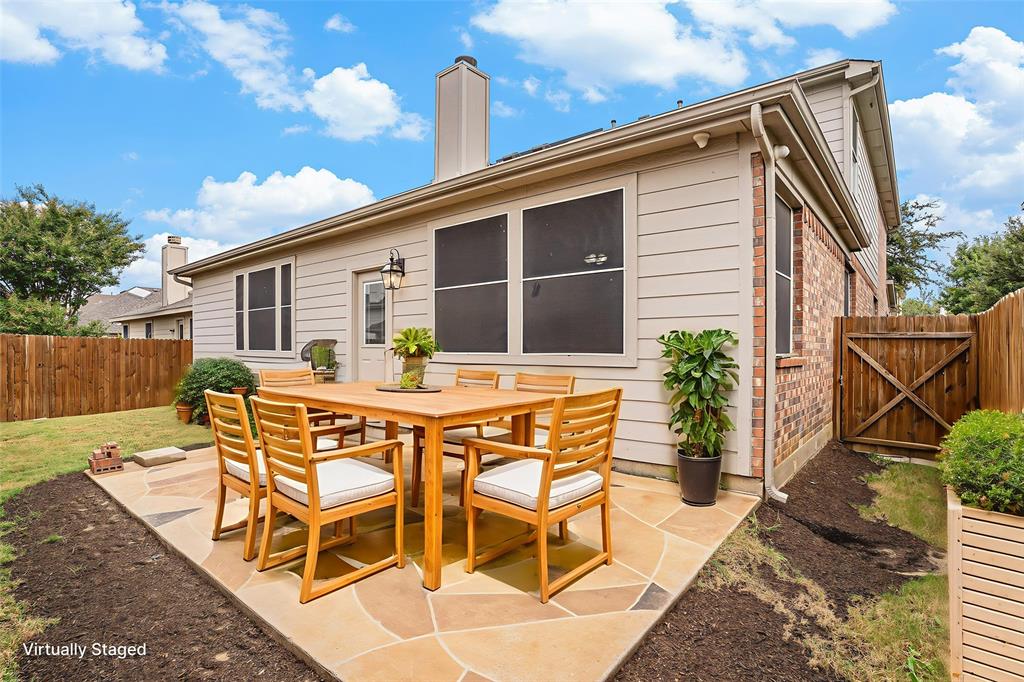 10005 Shelburne Road Fort Worth, TX 76244 - Photo 25 of 26 a view of a house with backyard and sitting area