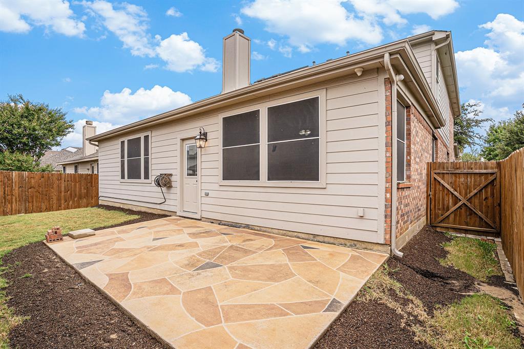 10005 Shelburne Road Fort Worth, TX 76244 - Photo 26 of 26 a backyard of a house with seating space