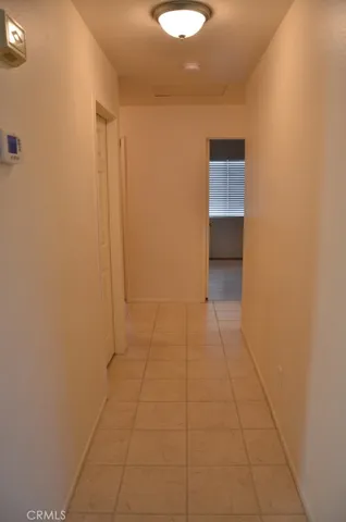 a view of an empty room with a bathroom