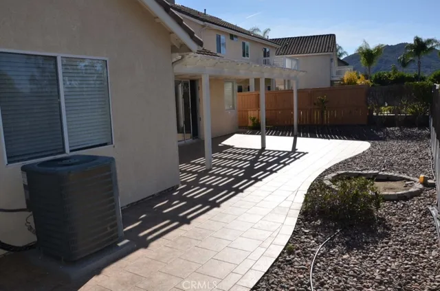 a bathroom with a granite countertop sink and a shower