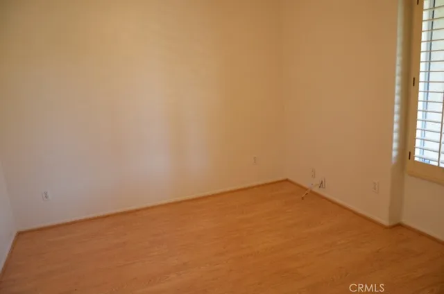 a view of an empty room and a window