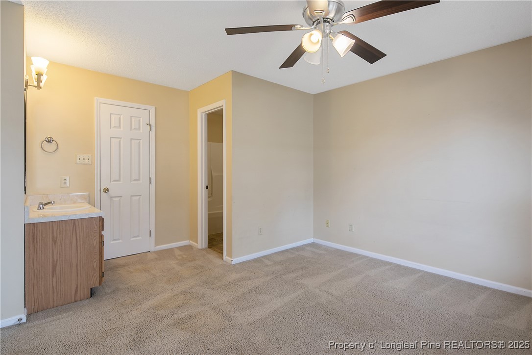 7383 Elliott Bridge Road Spring Lake, NC 28390 - Photo 22 of 42 an empty room with closet and windows