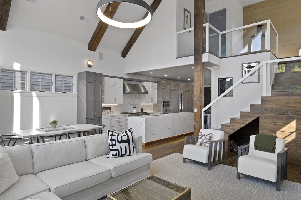 719 East 2nd Street, Unit PH3 Boston, MA 02127 - Photo 12 of 38 a living room with furniture kitchen view and a large window