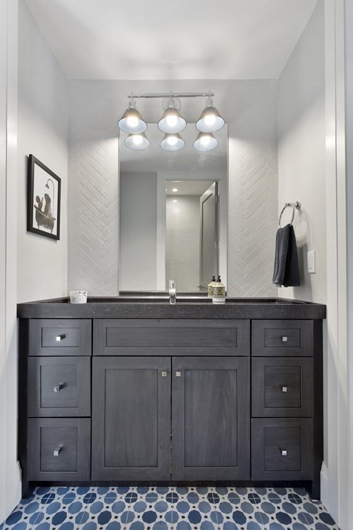 719 East 2nd Street, Unit PH3 Boston, MA 02127 - Photo 28 of 38 a bathroom with a sink vanity and mirror