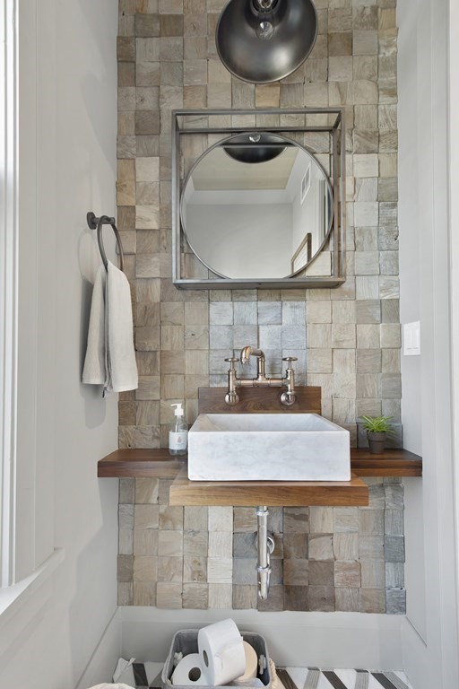 719 East 2nd Street, Unit PH3 Boston, MA 02127 - Photo 29 of 38 a bathroom with a sink a toilet and mirror