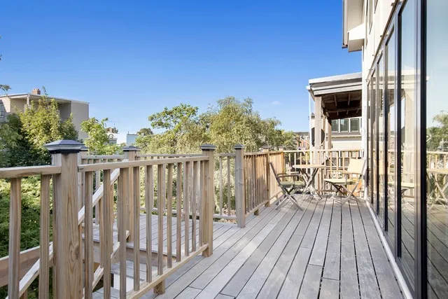 a view of balcony with furniture