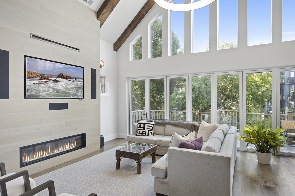 719 East 2nd Street, Unit PH3 Boston, MA 02127 - Photo 3 of 38 a living room with furniture and a floor to ceiling window