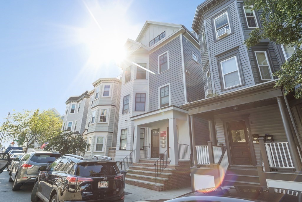 719 East 2nd Street, Unit PH3 Boston, MA 02127 - Photo 35 of 38 a front view of a residential apartment building with a yard
