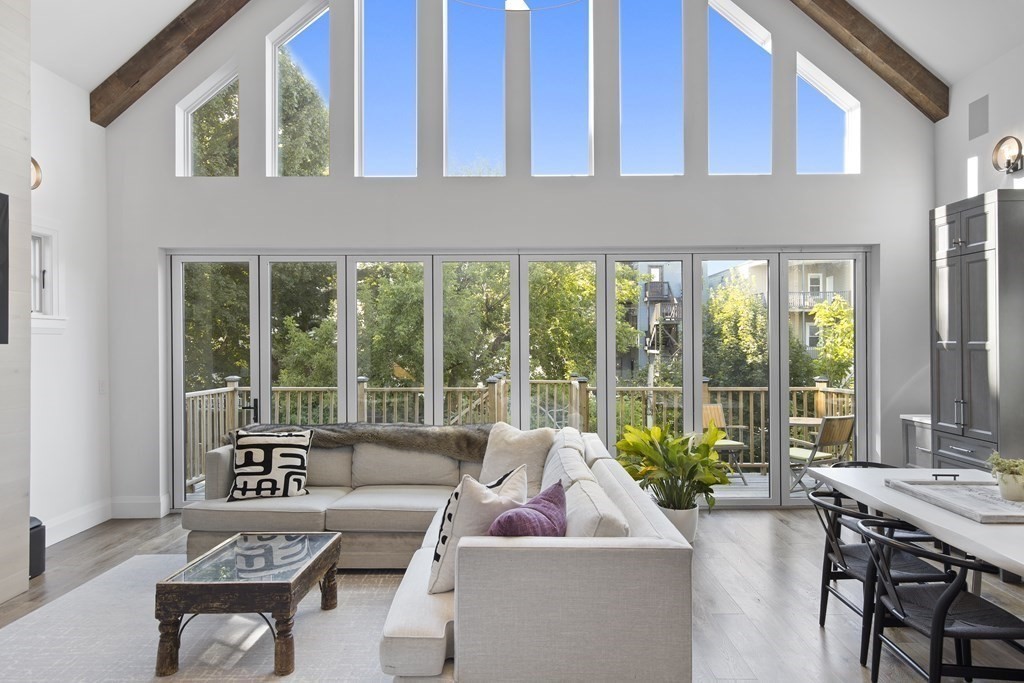 719 East 2nd Street, Unit PH3 Boston, MA 02127 - Photo 4 of 38 a living room with furniture and a window