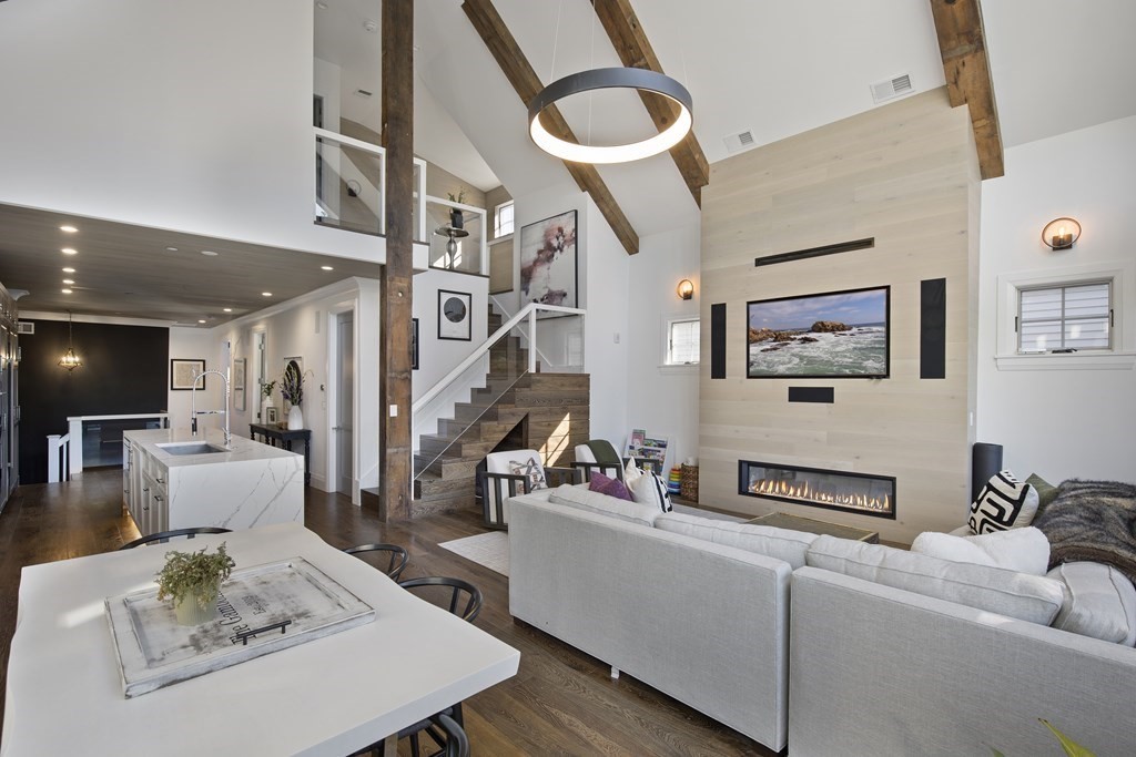 719 East 2nd Street, Unit PH3 Boston, MA 02127 - Photo 8 of 38 a living room with furniture and a flat screen tv