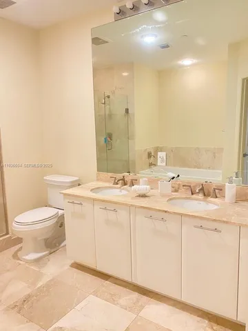 a bedroom with a bed and a cabinets