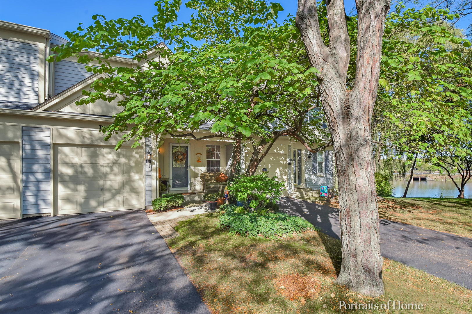 75 St Croix Court Aurora, IL 60504 - Photo 1 of 20 a front view of a house with a tree in a yard