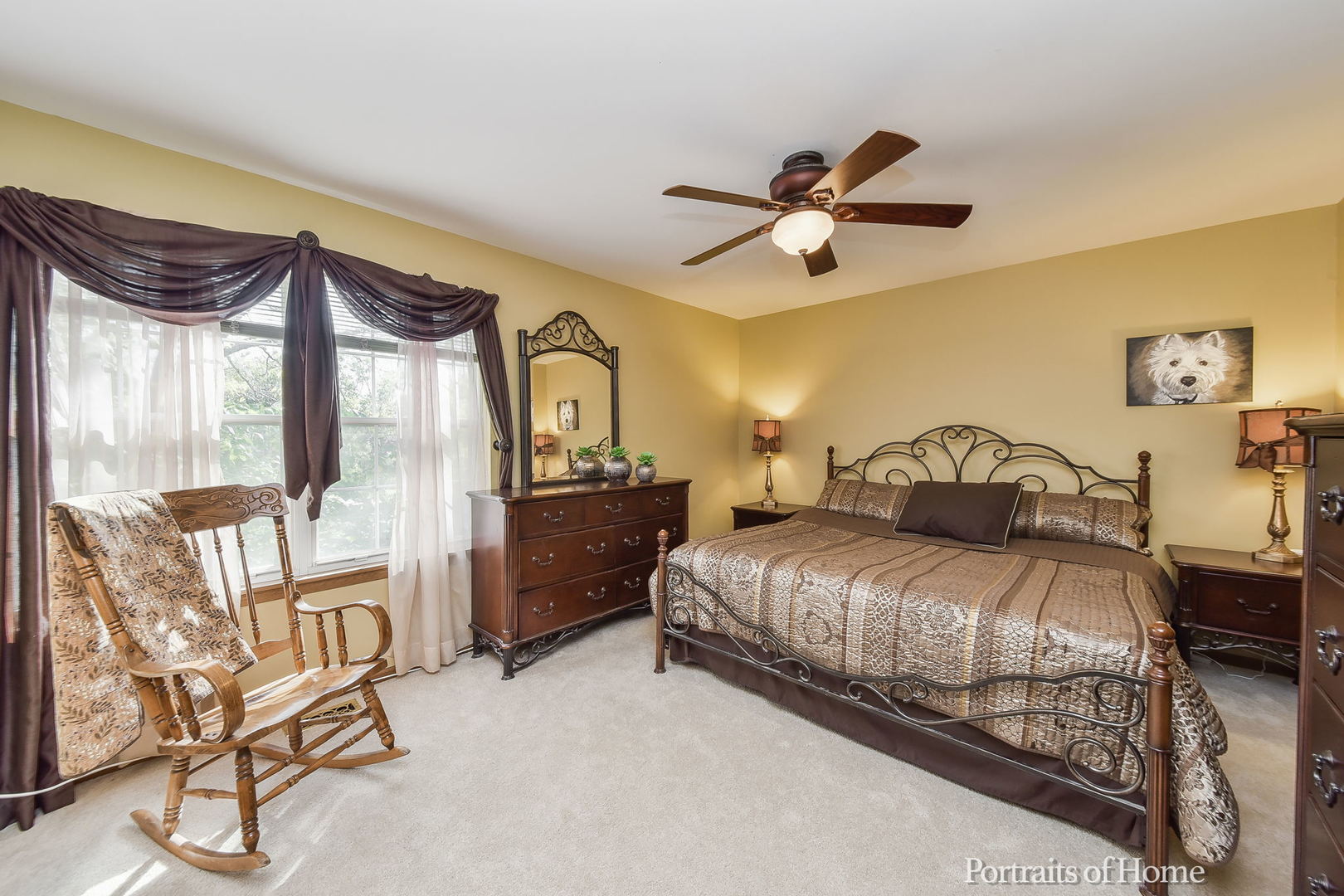 75 St Croix Court Aurora, IL 60504 - Photo 11 of 20 a bedroom with a bed a chandelier and a window