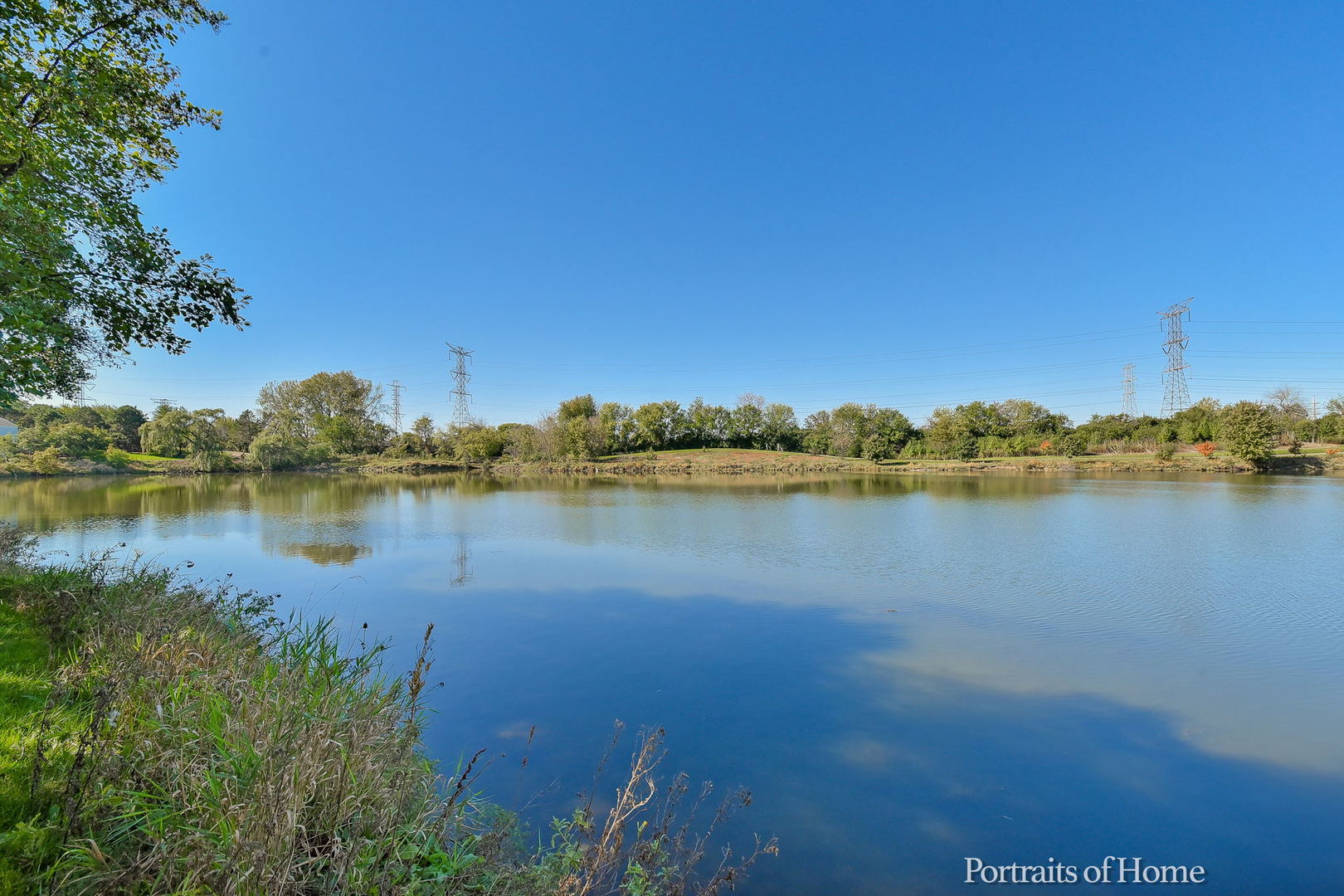 75 St Croix Court Aurora, IL 60504 - Photo 19 of 20 a view of a lake with houses in the back