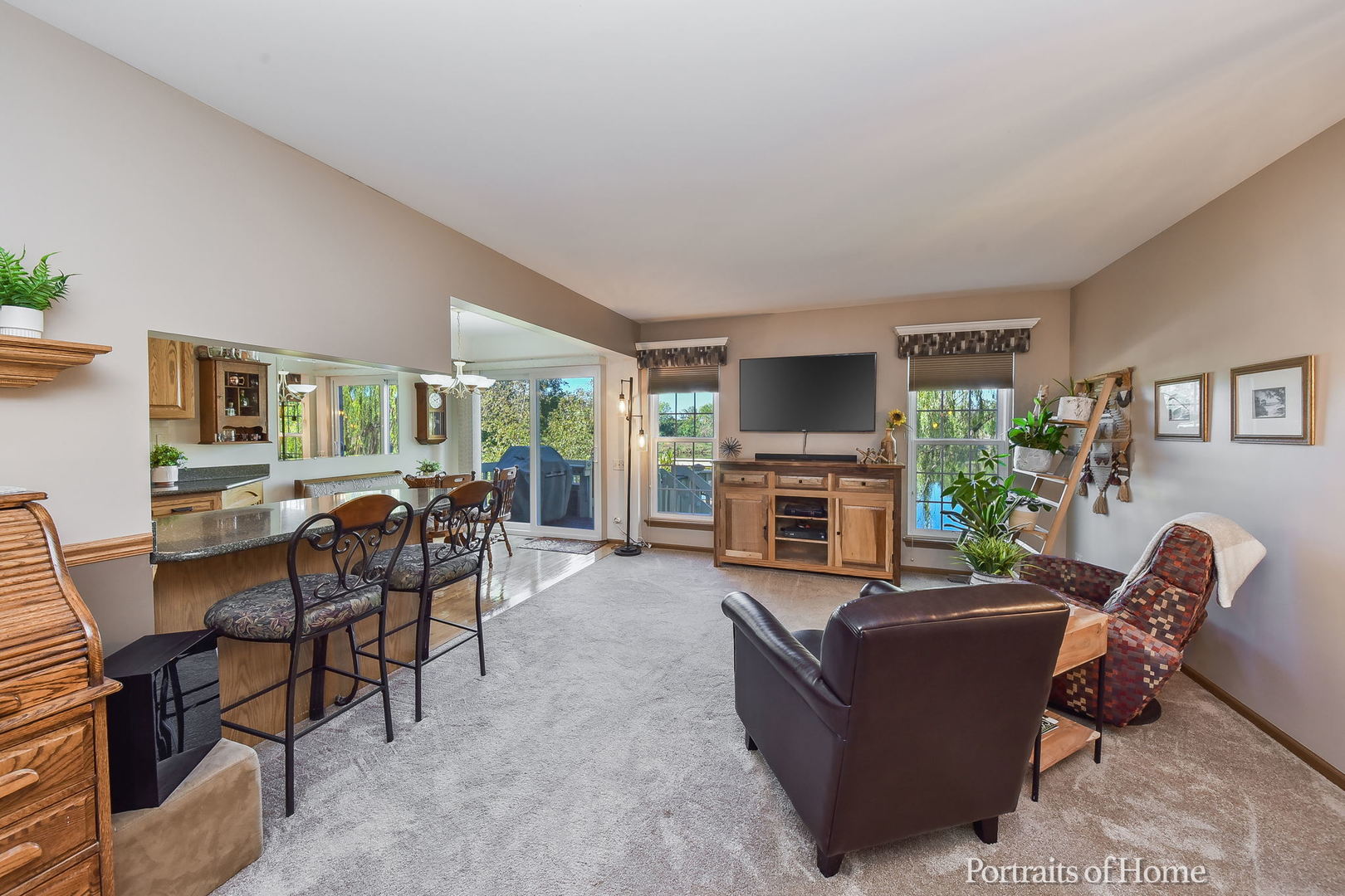 75 St Croix Court Aurora, IL 60504 - Photo 4 of 20 a living room with furniture a fireplace and a flat screen tv