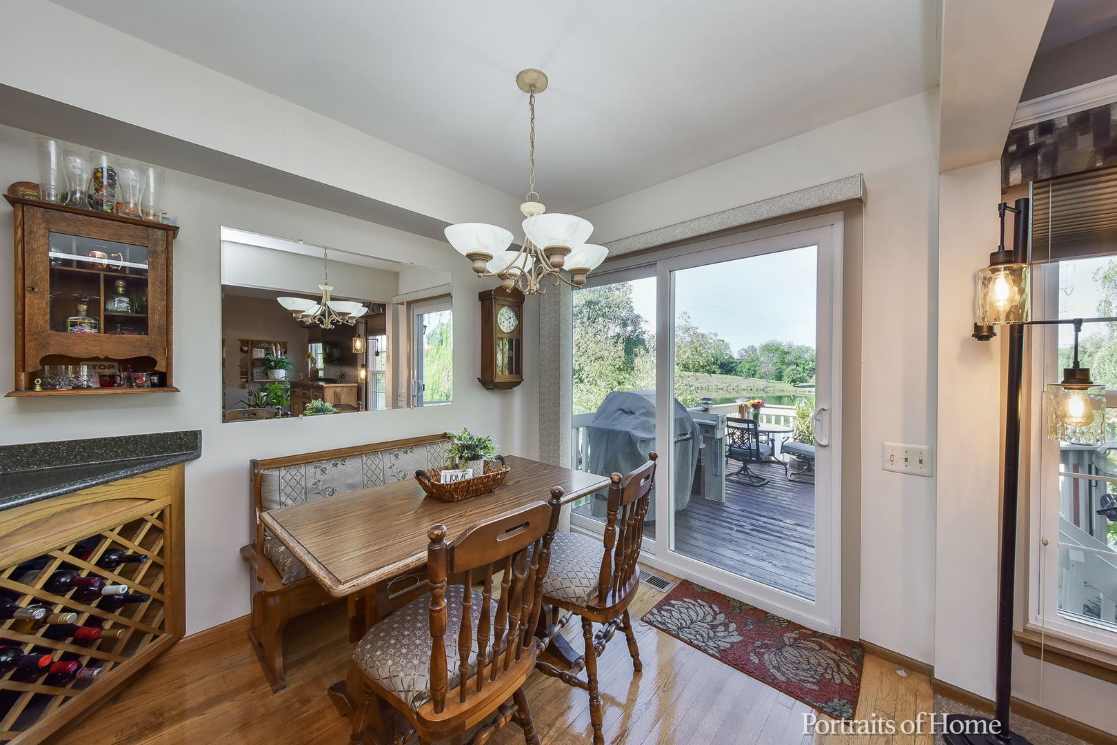75 St Croix Court Aurora, IL 60504 - Photo 7 of 20 a dining room with furniture a chandelier and wooden floor