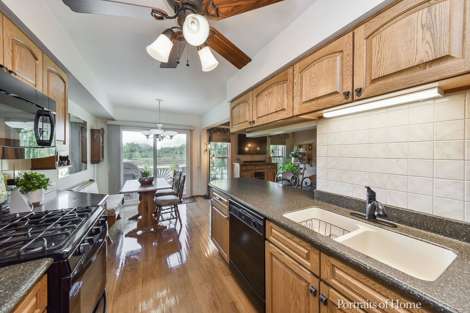 75 St Croix Court Aurora, IL 60504 - Photo 9 of 20 a kitchen with sink stove and cabinets