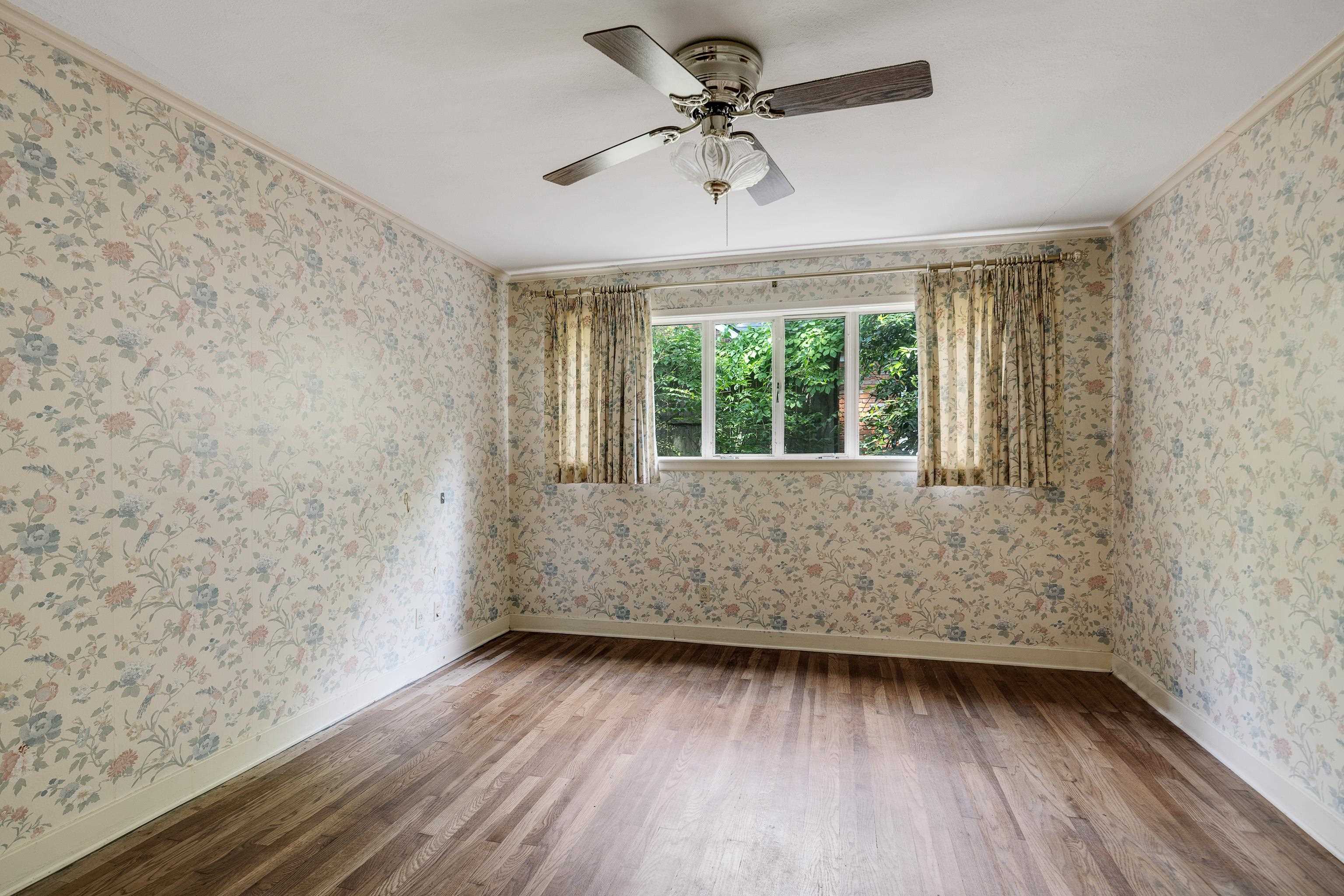 4356 Tuckahoe Road Memphis, TN 38117 - Photo 14 of 25 wooden floor in an empty room with a window