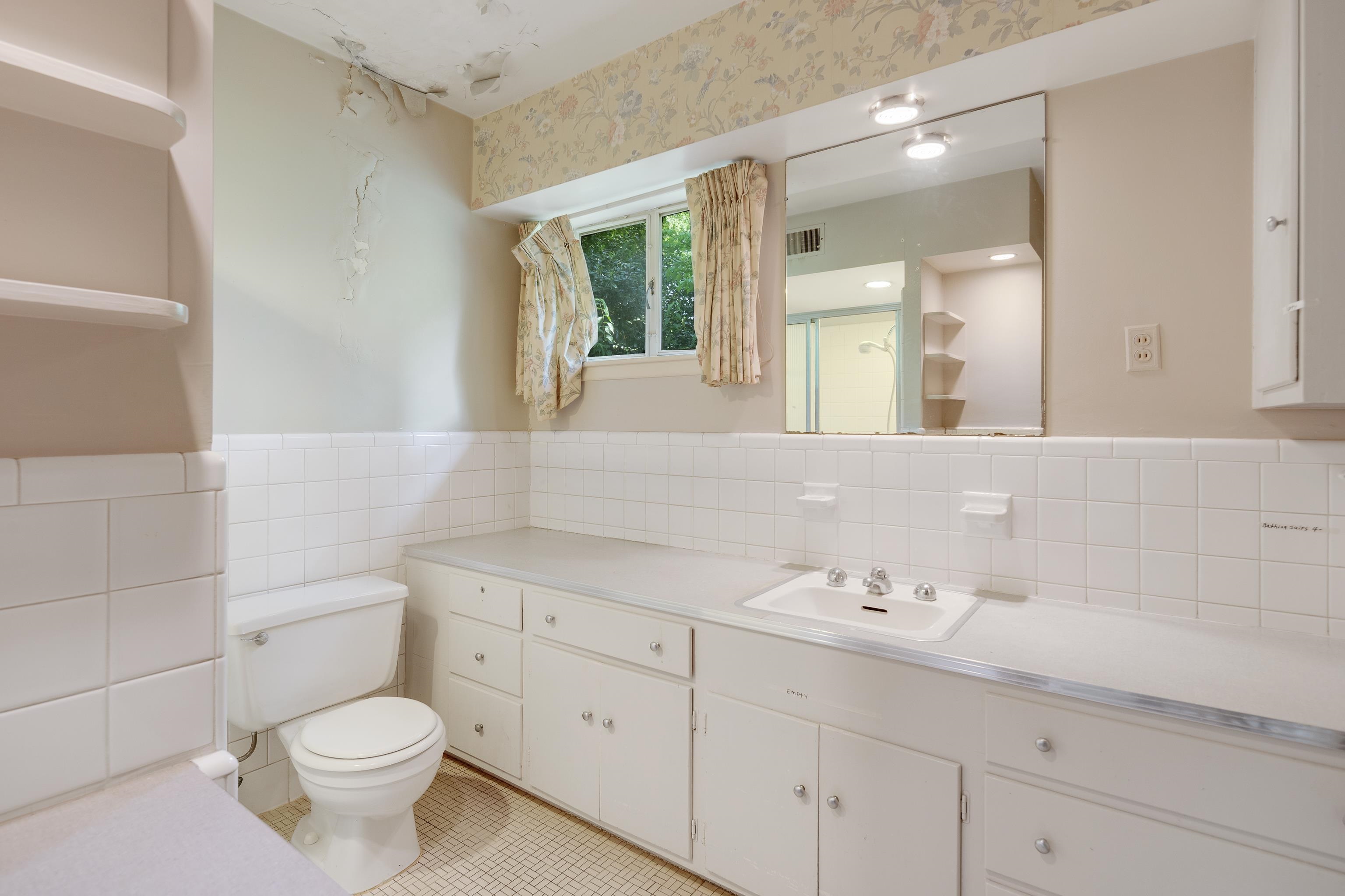 4356 Tuckahoe Road Memphis, TN 38117 - Photo 16 of 25 a bathroom with a toilet sink and mirror