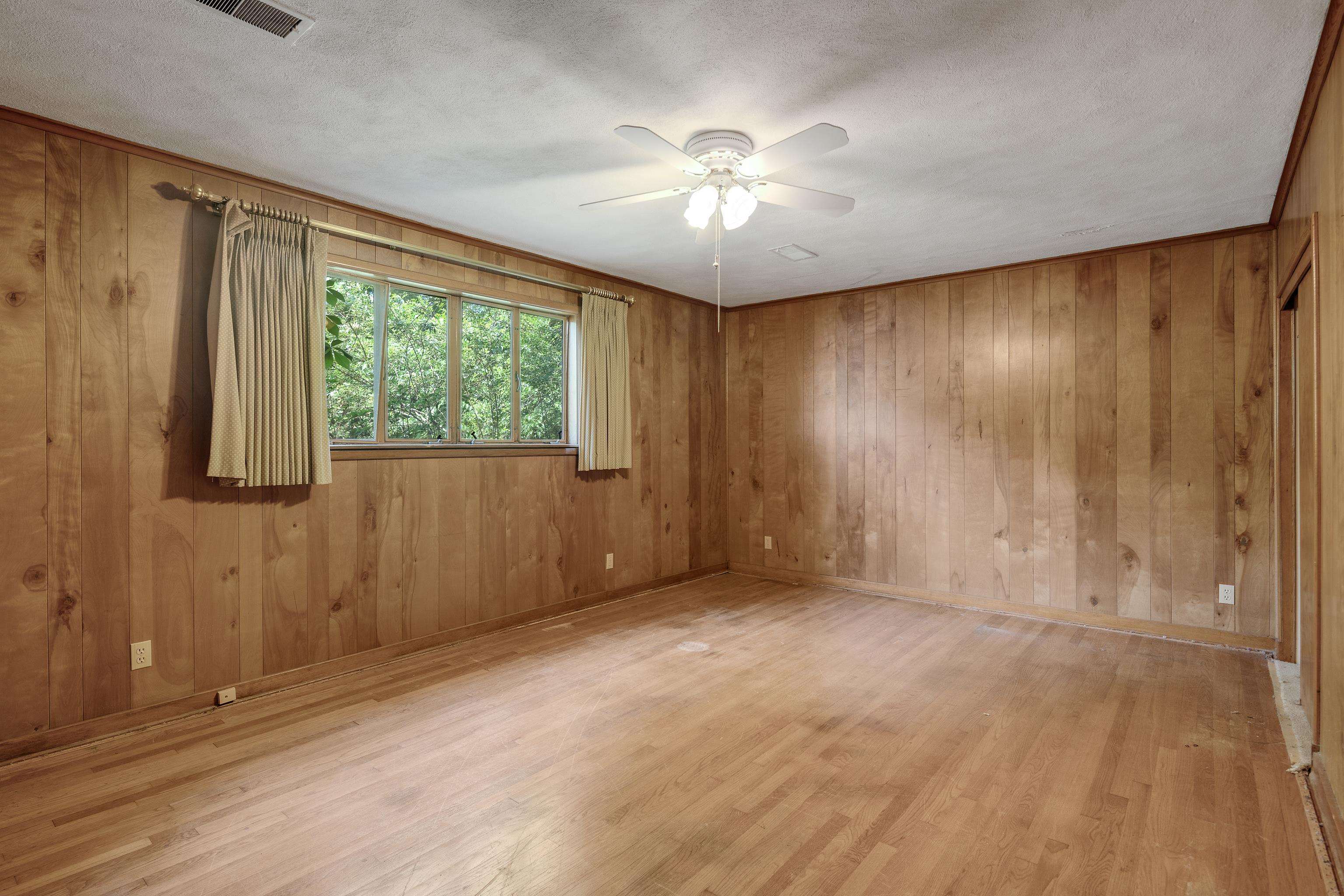 4356 Tuckahoe Road Memphis, TN 38117 - Photo 18 of 25 wooden floor in an empty room with a window